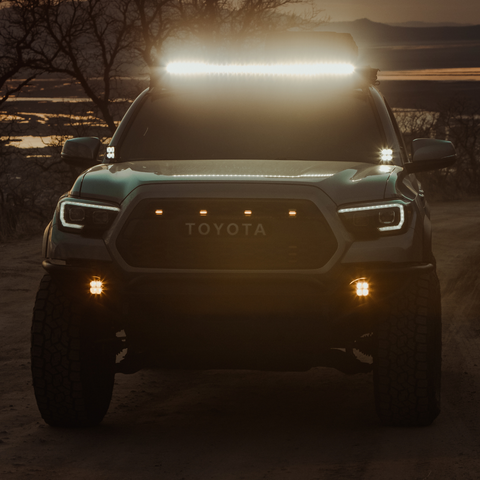 quattro led pod light mounted on a toyota tacoma as a fog light