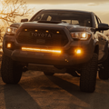 amber led behind the grille light bar mounted on a toyota tacoma