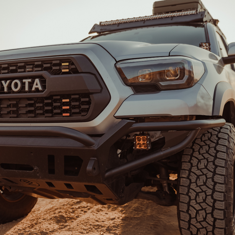 quattro led pod light mounted on a toyota tacoma as a fog light